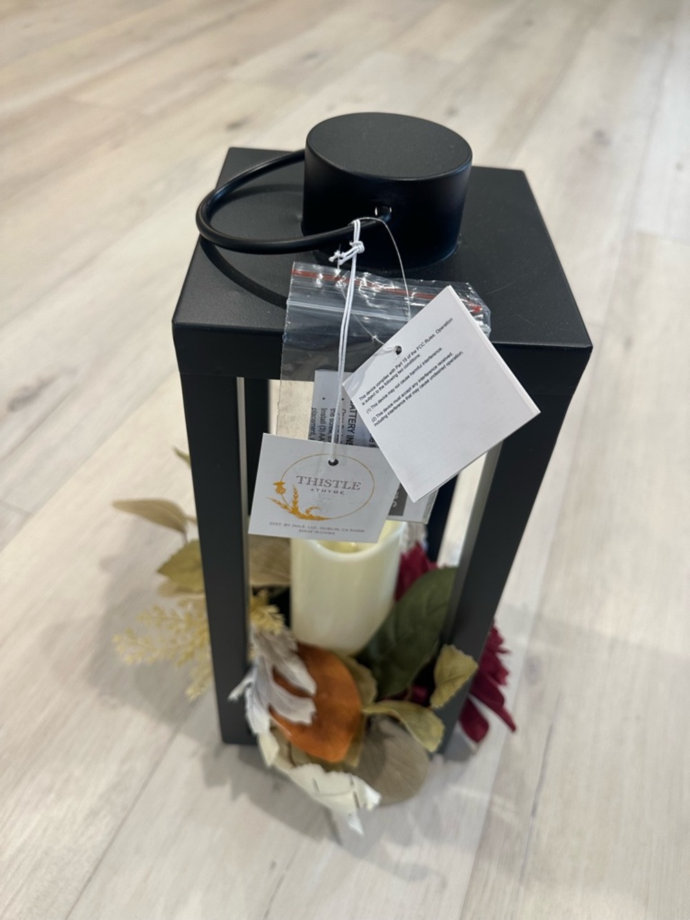 Black Lantern with Faux Candle and Floral Accent